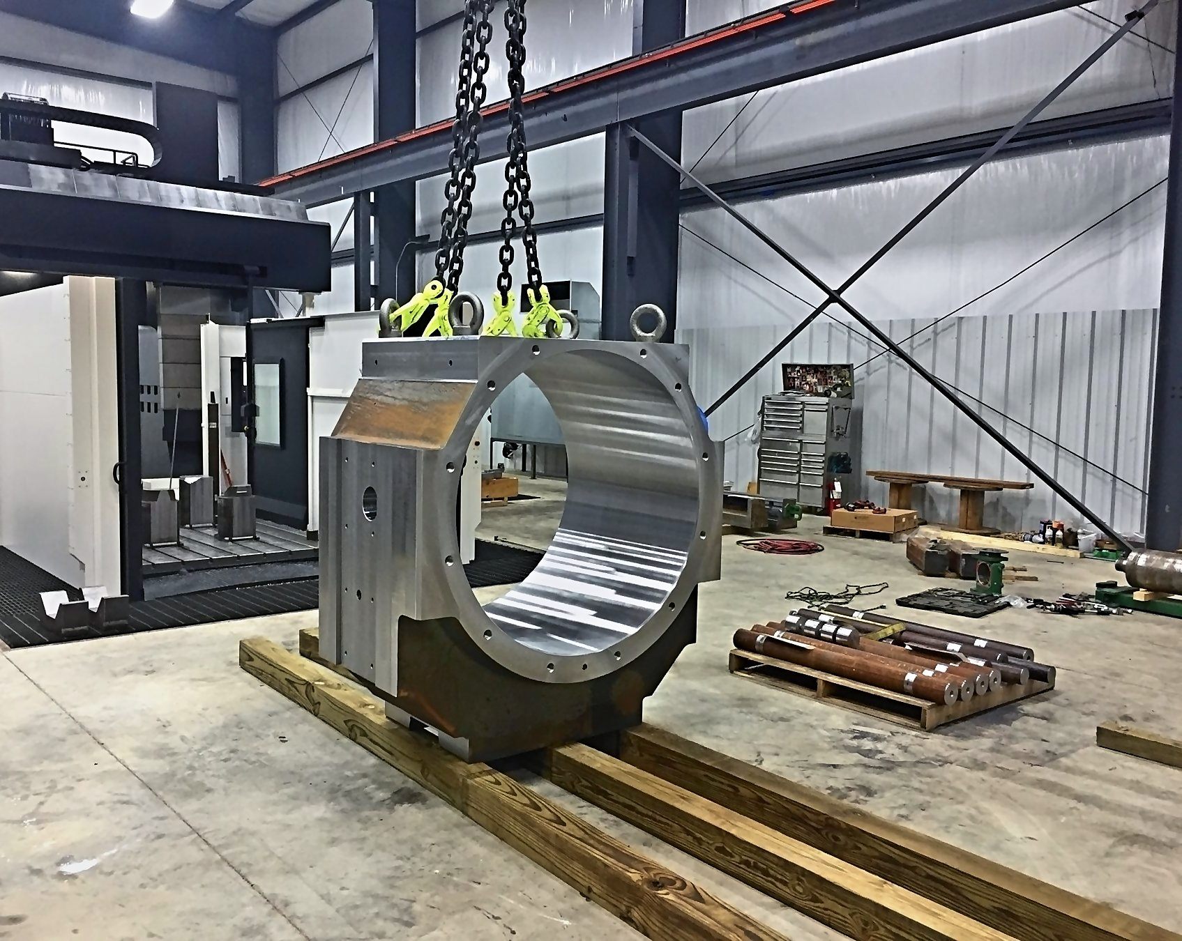 Brand-new chock with a freshly machined bore, rigged and set on timbers