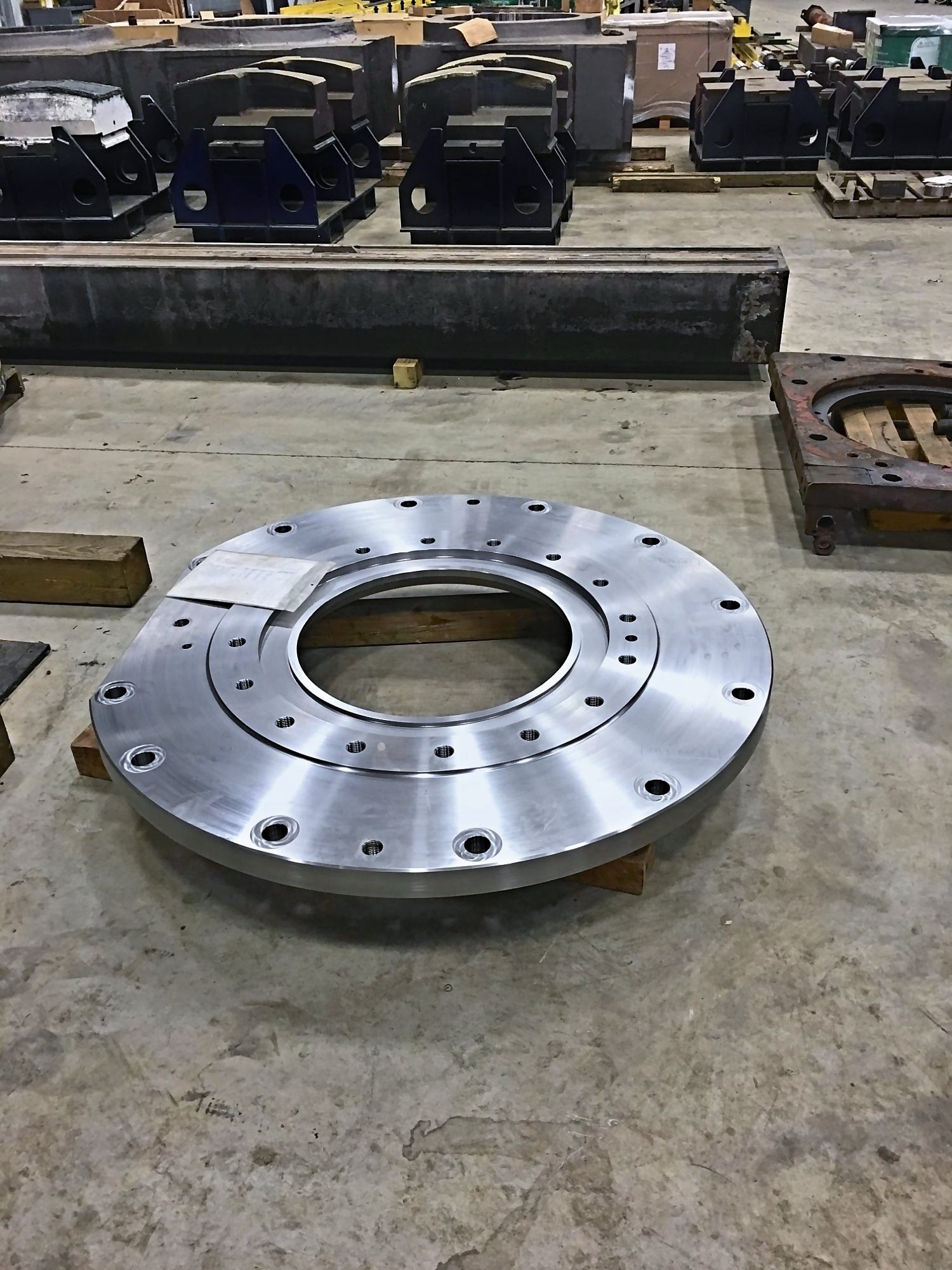 A large machined flange with bolt circles and a stepped bore